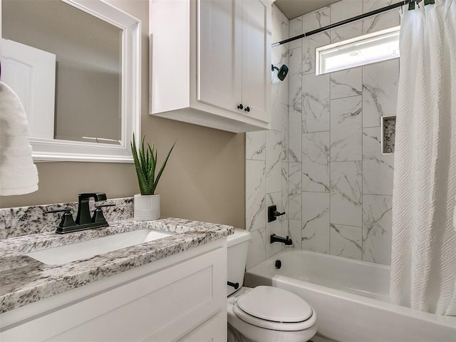 full bathroom with shower / tub combo, vanity, and toilet