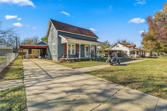 view of front of property featuring covered porch, a front yard, and a carport