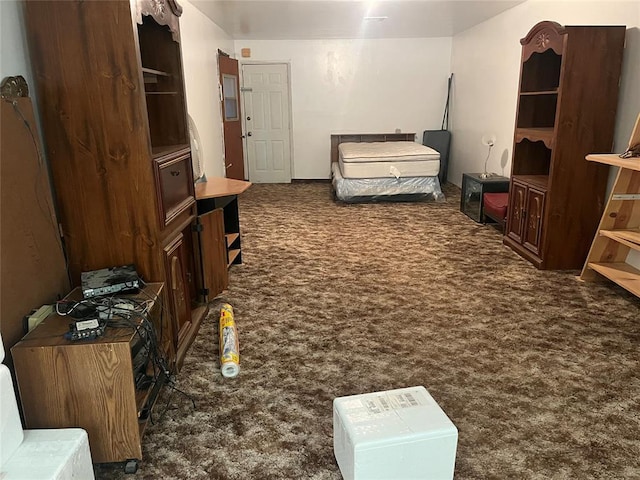 bedroom with dark colored carpet