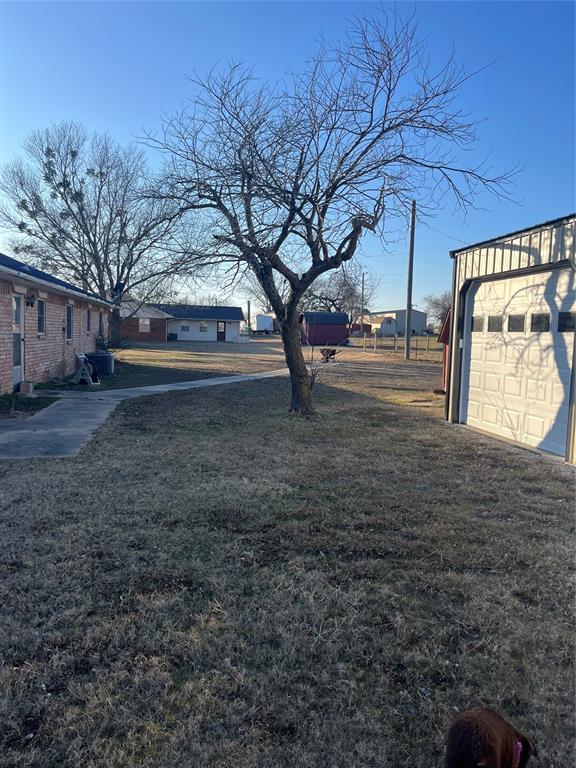 view of yard featuring a garage