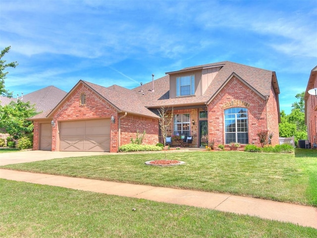 view of front of home featuring a front lawn and a garage