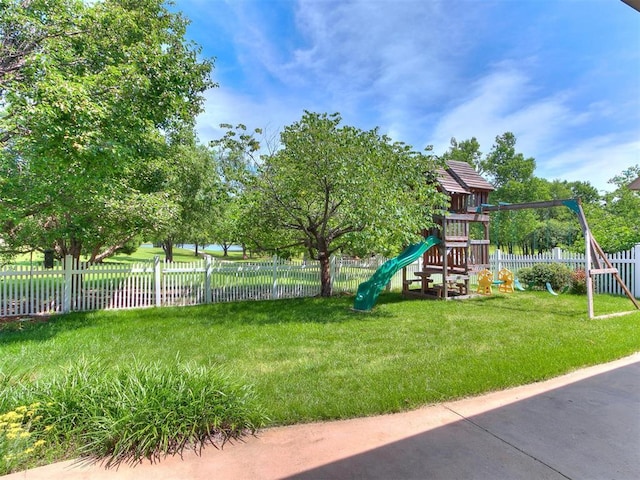 view of playground featuring a lawn