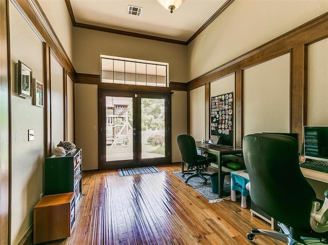 office area featuring crown molding, french doors, and wood-type flooring