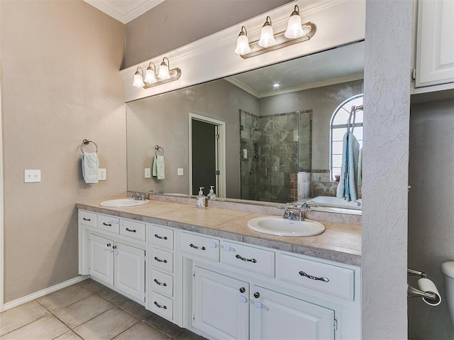 bathroom with tile patterned floors, vanity, ornamental molding, and walk in shower