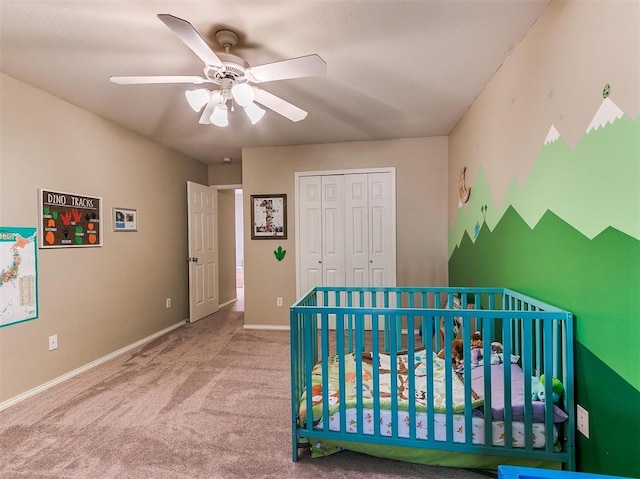 bedroom featuring ceiling fan, light colored carpet, and a closet