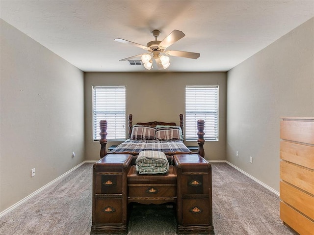 bedroom with ceiling fan and carpet floors