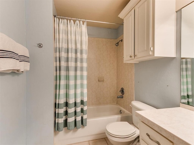 full bathroom featuring tile patterned floors, vanity, toilet, and shower / bath combo with shower curtain