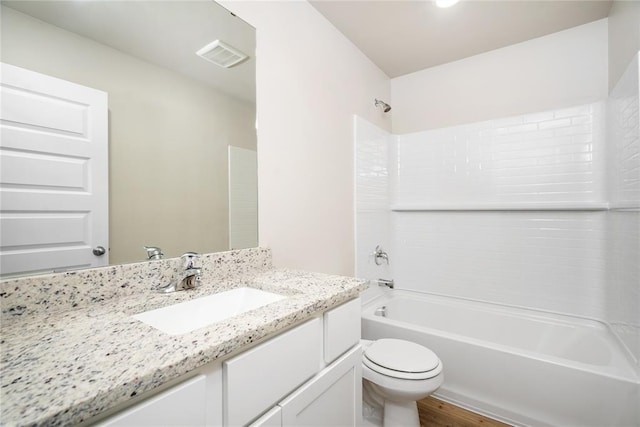 5435 Mac Rd, Tuttle, OK 73089 - full bathroom featuring bathtub / shower combination, wood-type flooring, vanity, and toilet