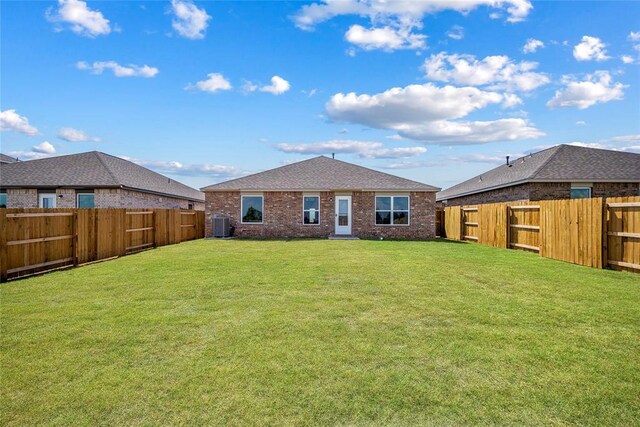 5435 Mac Rd, Tuttle, OK 73089 - back of house featuring a yard and cooling unit