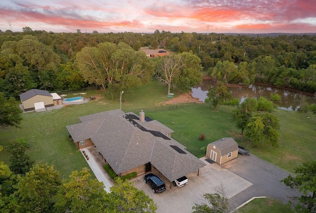 aerial view at dusk with a water view