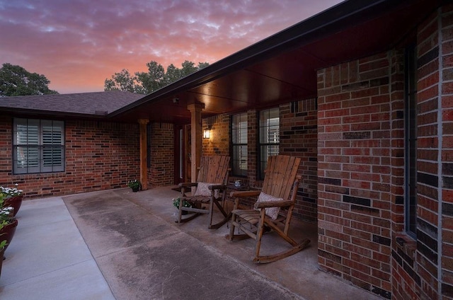 view of patio terrace at dusk