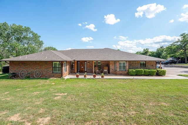 single story home featuring a patio and a front lawn