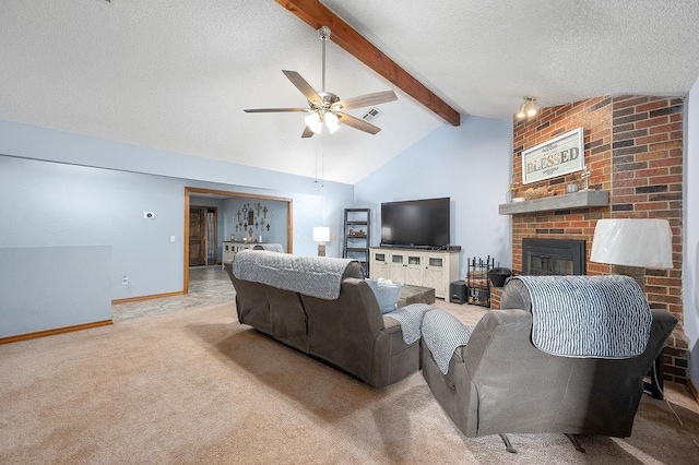 carpeted living room featuring vaulted ceiling with beams, ceiling fan, a textured ceiling, and a brick fireplace