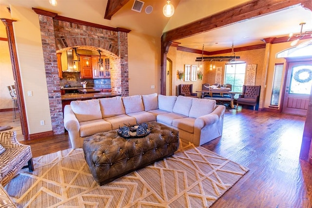 living room with hardwood / wood-style flooring and beamed ceiling