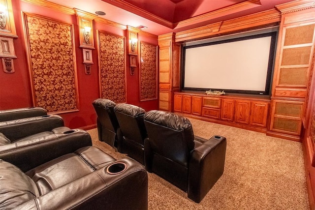 cinema featuring carpet, a raised ceiling, and crown molding