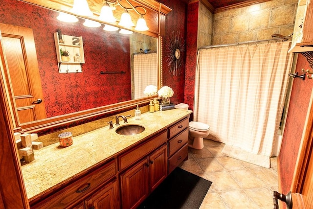 bathroom featuring tile patterned floors, vanity, and toilet