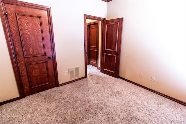 unfurnished bedroom with light carpet