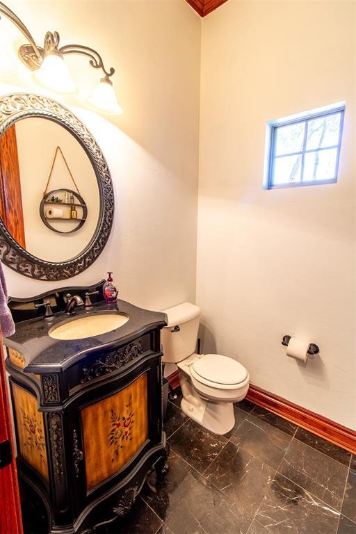 bathroom with vanity and toilet