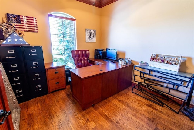 office space featuring crown molding and hardwood / wood-style floors