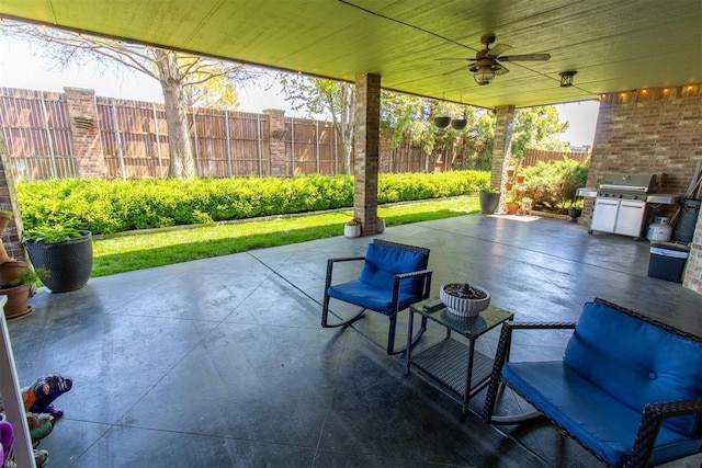 view of patio with ceiling fan and a grill