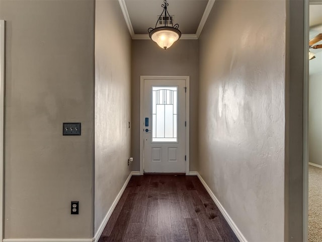 entryway with crown molding and dark hardwood / wood-style flooring