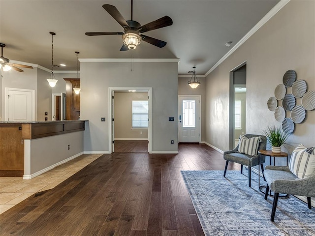 interior space featuring dark hardwood / wood-style flooring, ceiling fan, and ornamental molding