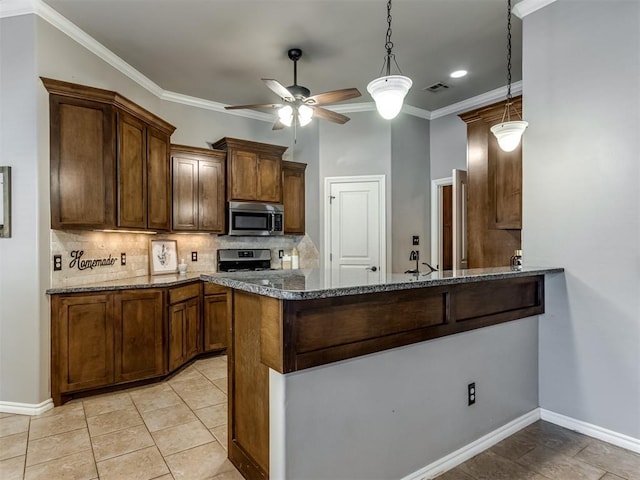 kitchen with kitchen peninsula, crown molding, decorative light fixtures, and appliances with stainless steel finishes