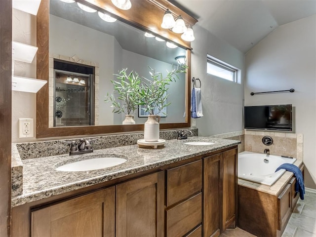 bathroom with vanity, separate shower and tub, and lofted ceiling