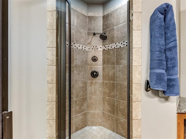 bathroom with tiled shower