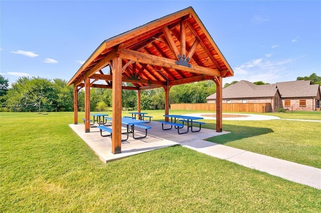 surrounding community with a gazebo, a yard, and a patio area