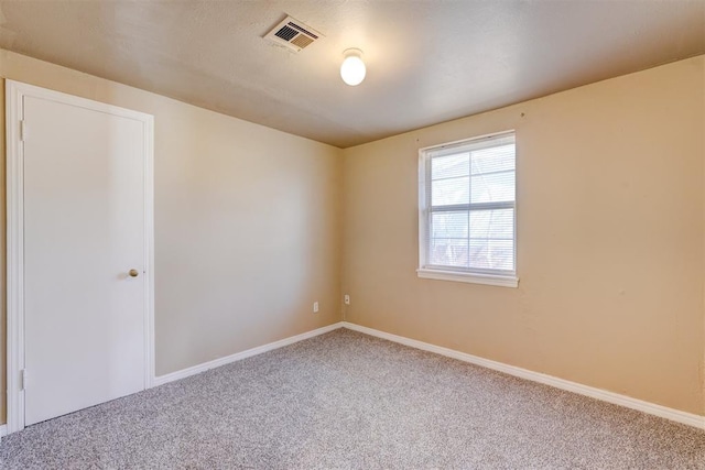 view of carpeted spare room