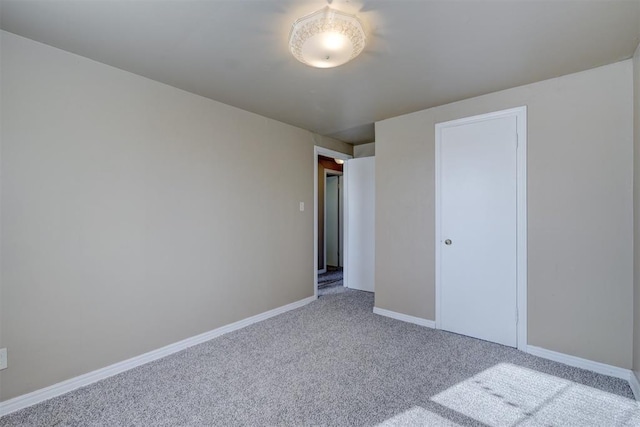 unfurnished bedroom with carpet floors and a closet