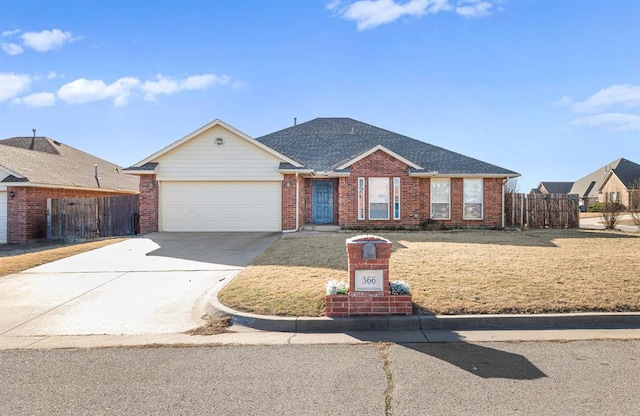 ranch-style home with a front yard and a garage