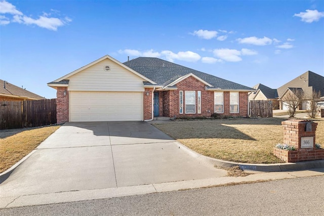 ranch-style house featuring a front yard and a garage