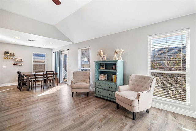 sitting room featuring ceiling fan, hardwood / wood-style floors, and vaulted ceiling