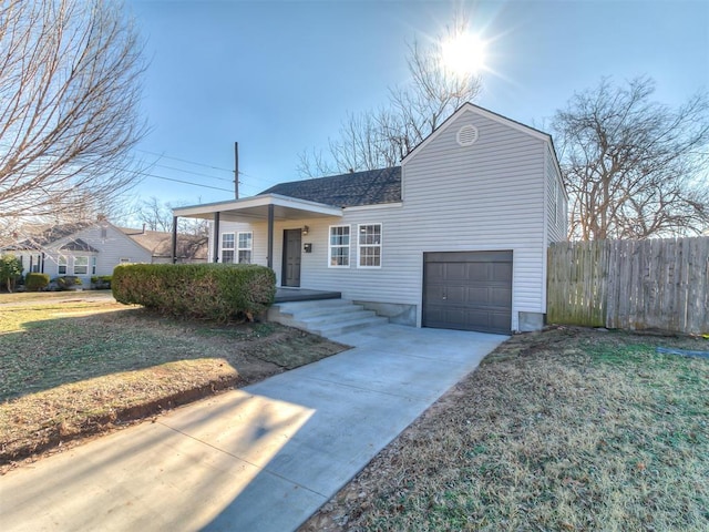 ranch-style home featuring a front lawn and a garage