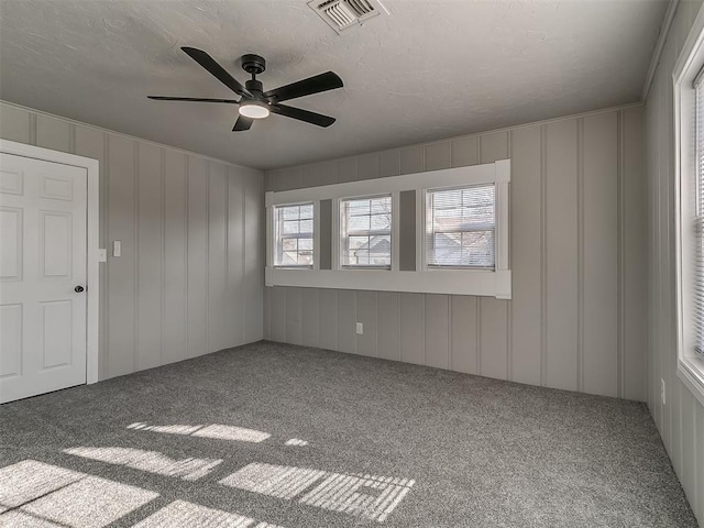 empty room with carpet and ceiling fan