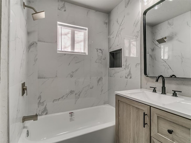 bathroom featuring vanity and  shower combination