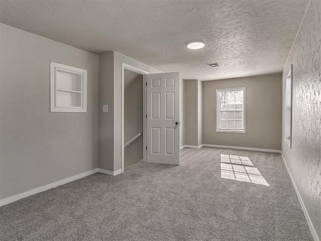 interior space with a textured ceiling and built in features