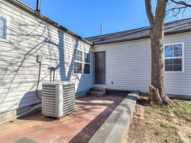 exterior space featuring cooling unit and a patio area