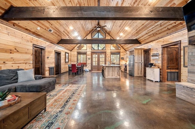 living room with wooden walls, high vaulted ceiling, and wooden ceiling