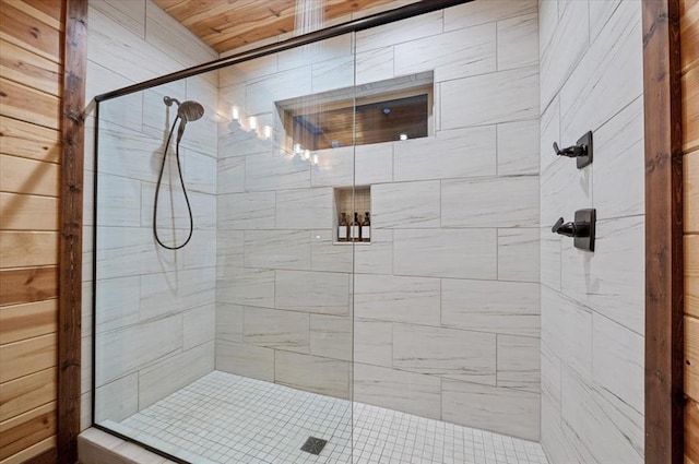 bathroom featuring a shower with door