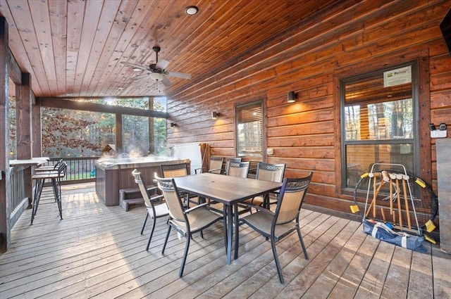 wooden terrace featuring a hot tub and ceiling fan