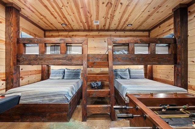 bedroom with wood ceiling and wooden walls