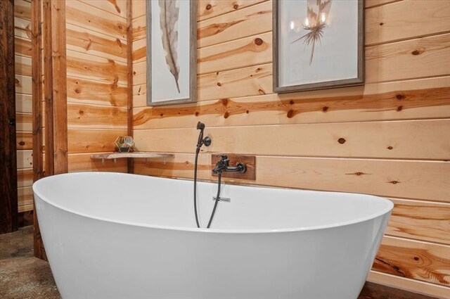 full bath with wood walls and a freestanding bath