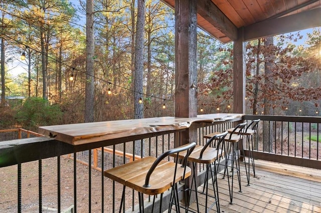 wooden deck with outdoor dry bar