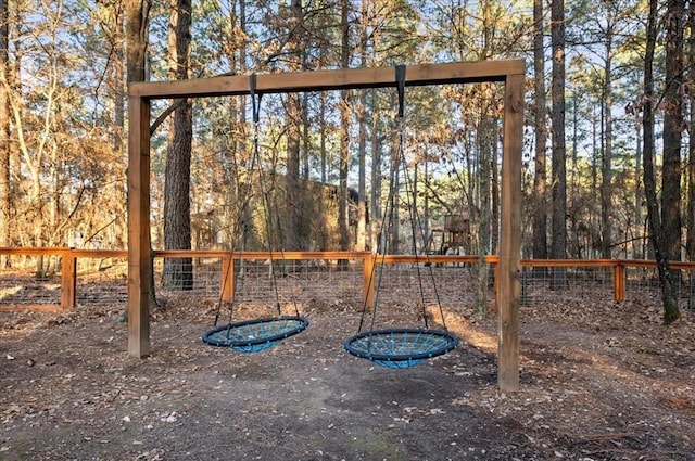 view of jungle gym with fence