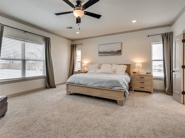 bedroom with ornamental molding, ceiling fan, and light colored carpet