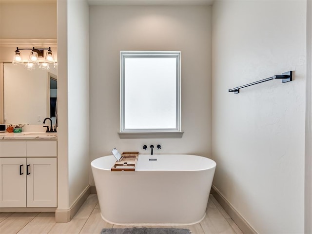 bathroom featuring vanity, a bathtub, and tile patterned flooring