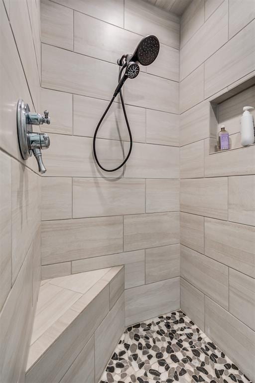 bathroom featuring tiled shower